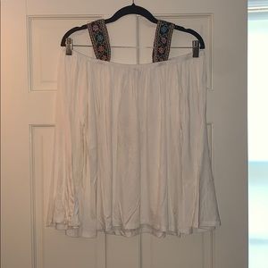 White blouse with detailed ribbon straps